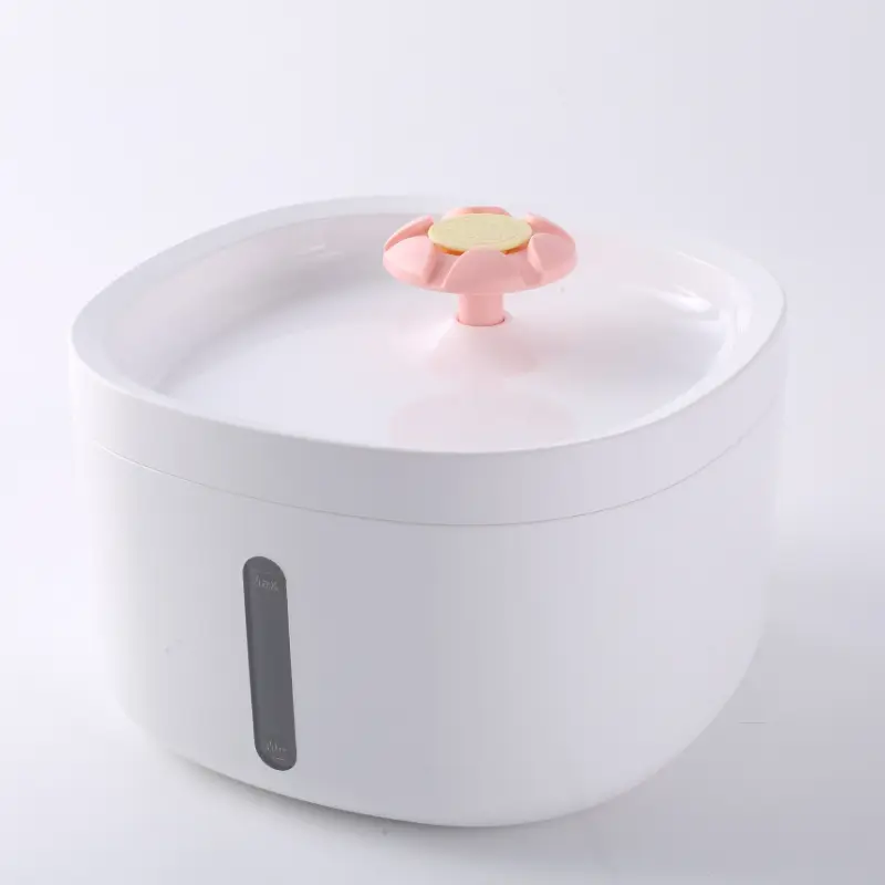 White pet water fountain with pink flower spout and transparent water level window.