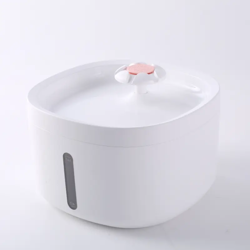 White pet water fountain with pink flower spout and transparent water level window.