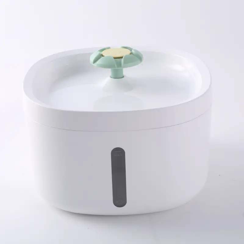 White pet water fountain with mint green flower spout and water level window.