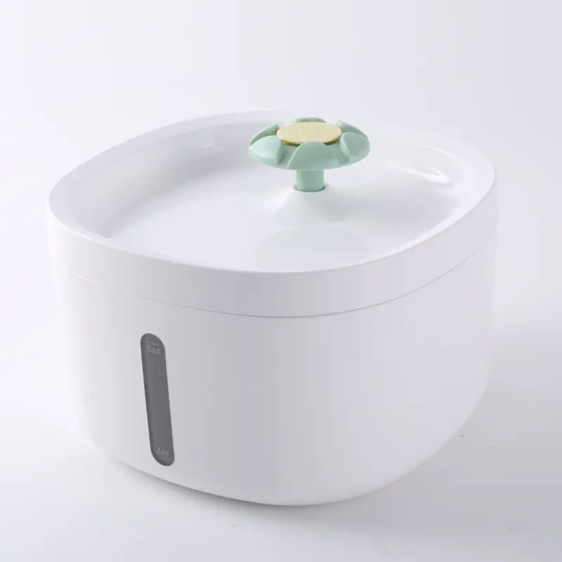 White pet water fountain with mint green flower spout and water level window.