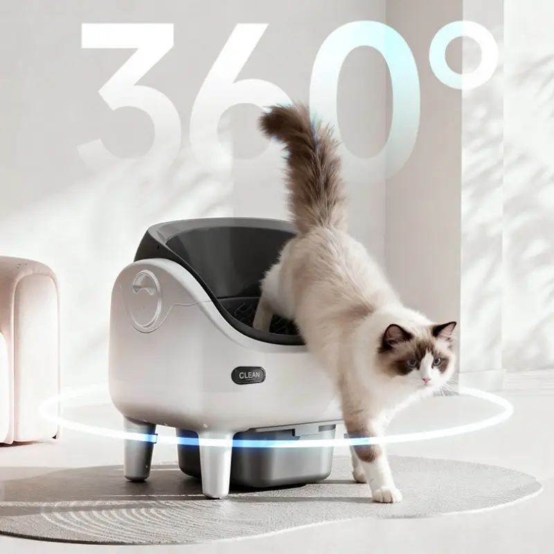 A Ragdoll cat stepping in and out of a 360° open smart self-clean cat litter box in a bright modern pet home interior