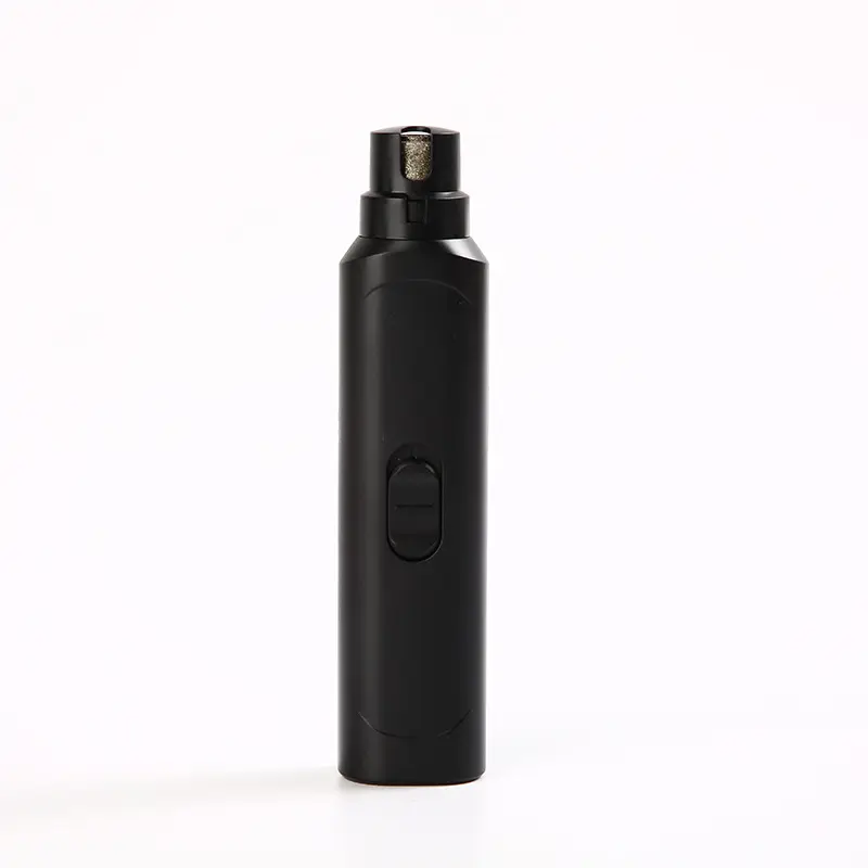 Black electric pet nail grinder with exposed grinding head and power switch.