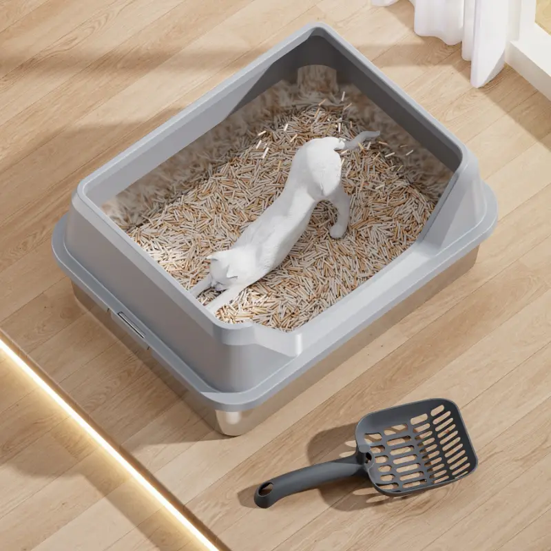 Light gray stainless steel cat litter box with matching litter scoop, anti-splash design, easy clean for cats and pet households.
