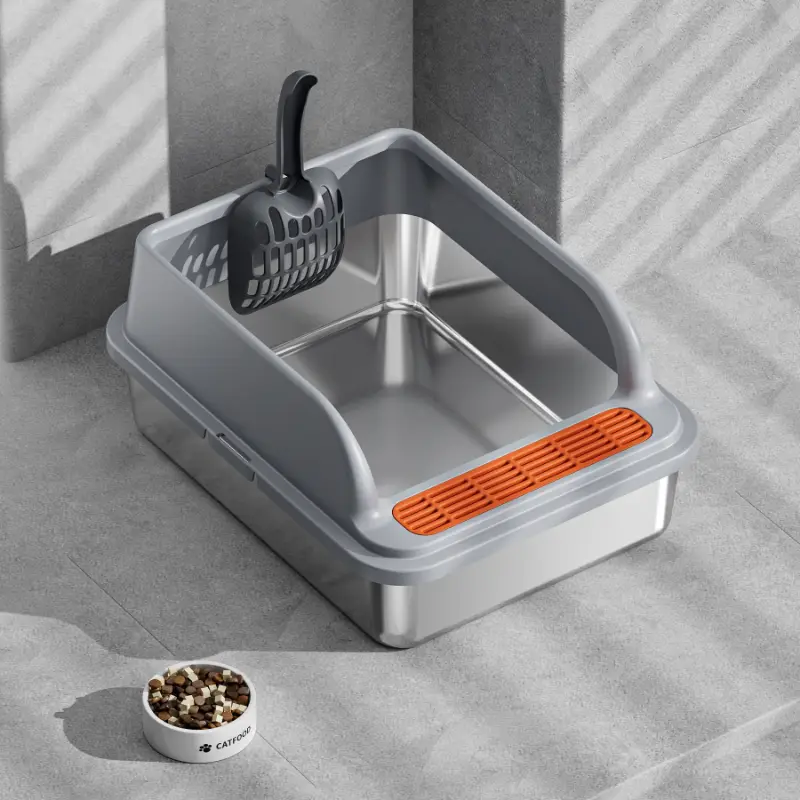 A durable stainless steel cat litter box with a matching litter scoop, designed for easy cleaning and pet hygiene maintenance