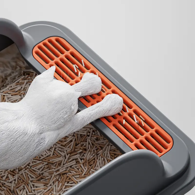 A white cat interacting with the leak-proof sand design of a stainless steel cat litter box, showcasing its practical structure