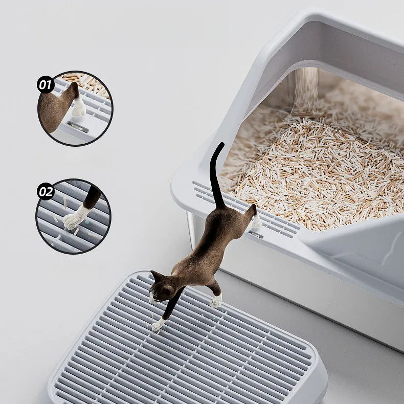 Brown cat stepping from stainless steel litter box onto anti-tracking mat, with anti-scatter guide diagrams