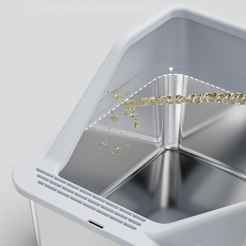 Close-up of stainless steel cat litter box with liquid splashing to show non-porous, stain-resistant surface