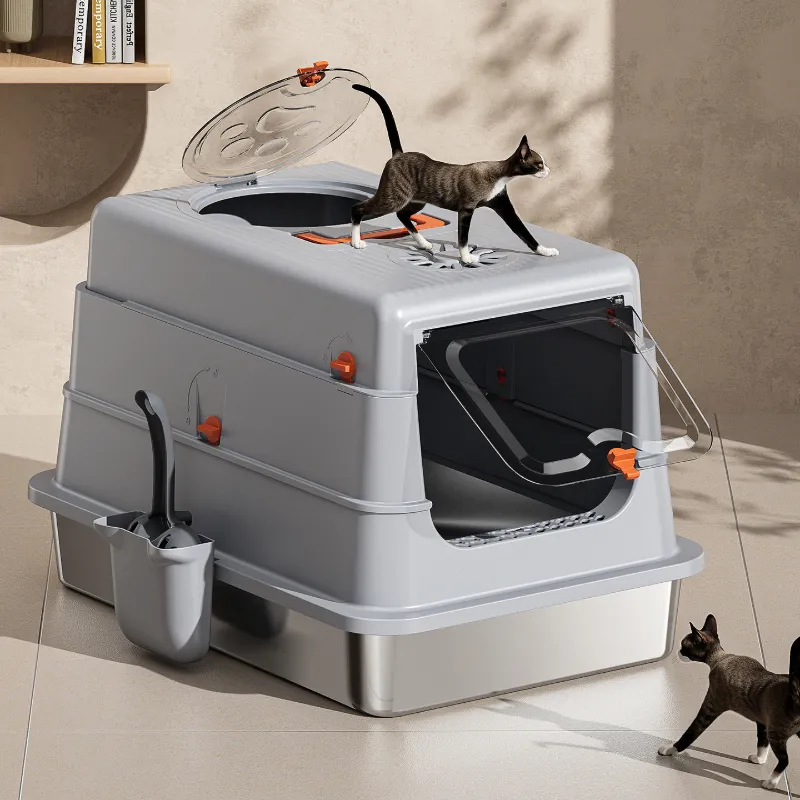 Light gray stainless steel cat litter box in home scene with cats, top entry & enclosed design