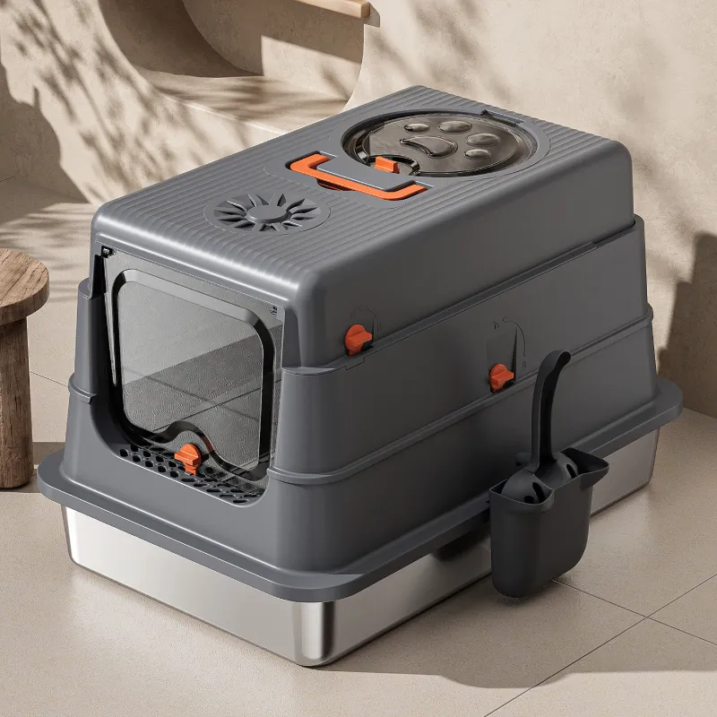 Gray stainless steel cat litter box in home setting, with stainless steel base and litter scoop holder